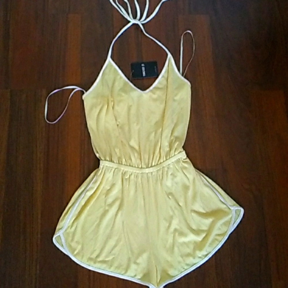 Light weight,, Yellow with white trim, sleeveless, tie around, jump suit.